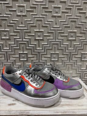 Nike Silver Low-Top Sneakers with Blue, Black, Purple & Orange Accents